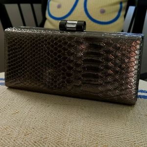 Silver crocodile clutch